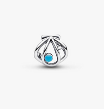 Load image into Gallery viewer, Silver charm with a blue gemstone on a white background

