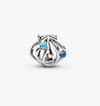 Load image into Gallery viewer, Silver charm with blue stones on a white background
