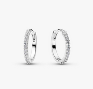 Pair of silver hoop earrings with clear gemstones on a white background