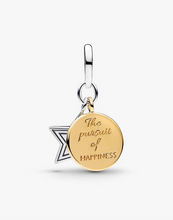 Load image into Gallery viewer, Gold and silver charm with 'The pursuit of happiness' engraving on a white background
