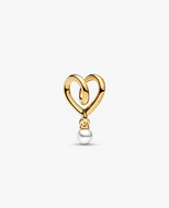 Gold heart-shaped pendant with a pearl on a white background