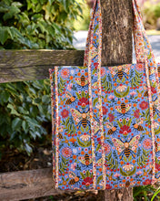 Load image into Gallery viewer, close up of bee print on a quilted tote hung on a fence post
