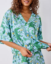 Load image into Gallery viewer, woman in the Printfresh Gator Grove Eco Satin Sweet Dreams Set in Blue Lagoon short sleeve button down top 
