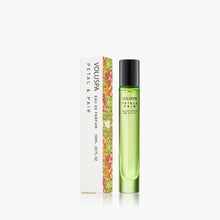 Load image into Gallery viewer, Voluspa Petal &amp; Pair Eau De Parfum tall green bottle next to voluspa branded ox
