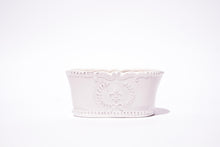 Load image into Gallery viewer, oval shaped white candle holder decorated with flue de lys 
