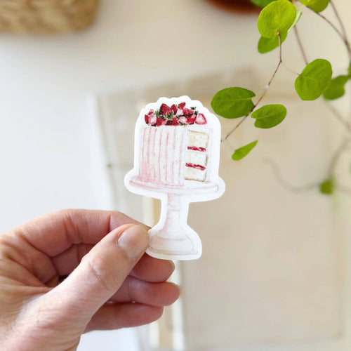 hand holding a Pink Cake with strawberries sitting on a cake stand Sticker on a watercolor style