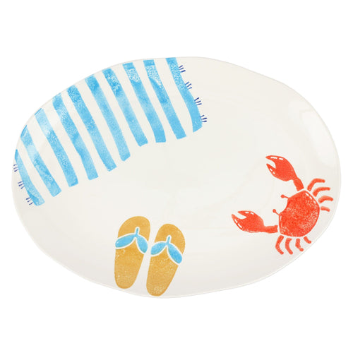 Oval platter with colorful painting of a crab flip flops and a beach towel