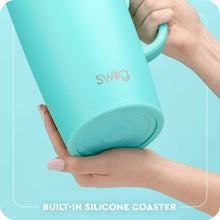 Load image into Gallery viewer, person holding a Swig Lemon Meringue Party Pitcher 64oz with the text built-in silicone coaster
