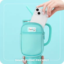 Load image into Gallery viewer, person putting a cellphone in a Mega Mug Pouch text reads smart phone friendly
