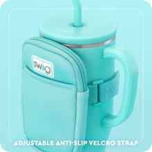 Load image into Gallery viewer, close up of the Mega Mug Pouch strap around the travel tumbler text reads Adjustable anti-slip velcro strap
