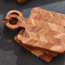 Load image into Gallery viewer, four small wood cutting board with wood handles tied together with leather
