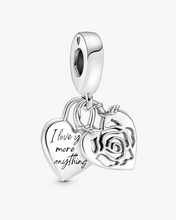 Load image into Gallery viewer, Silver charm with heart and rose design on a white background
