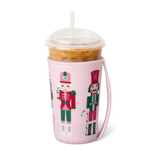 Load image into Gallery viewer, Swig Sugar Plum Soldiers Nutcracker Iced Cup Coolie - Medium showing handle 
