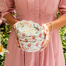 Load image into Gallery viewer, person holding a stack of Juliska Sofia Cereal/Ice Cream Bowl multi with colorful floral pattern
