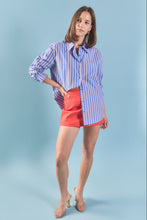 Load image into Gallery viewer, woman in Blue &amp; Orange Stripe Cotton Shirt paired with coral short skirt
