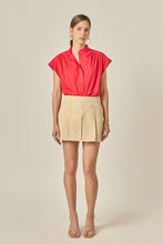 Load image into Gallery viewer, woman in the red Scallop Trim Ric Rac Short Sleeve Shirt paired with tan short skirt
