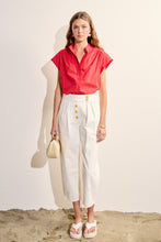Load image into Gallery viewer, woman in the red Scallop Trim Ric Rac Short Sleeve Shirt paired with white pants
