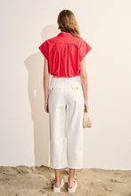 Load image into Gallery viewer, woman in the red Scallop Trim Ric Rac Short Sleeve Shirt paired with white pants back view
