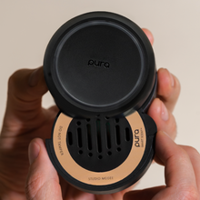 Load image into Gallery viewer, person putting a Santal Vanilla Pura Car Diffuser Refill into a diffuser 
