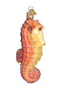 Load image into Gallery viewer, Old World Christmas Orange Seahorse Ornament
