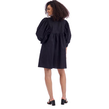 Load image into Gallery viewer, woman wearing short dress with 3/4 puffed sleeves photographed from the back
