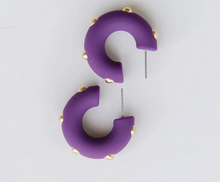 Load image into Gallery viewer, Purple crescent-shaped hoop earrings with small gold studs, displayed on a clean white background.
