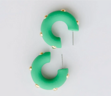 Load image into Gallery viewer, Green crescent-shaped hoop earrings with small gold studs, displayed on a light gray background.
