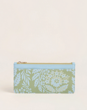 Load image into Gallery viewer, A small zip pouch with a light blue top border and a sage green floral patterned body, featuring a gold zipper pull, set against a plain off-white background.
