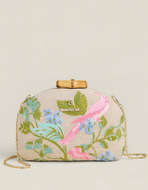 Embroidered handbag with floral and bird design on a beige background
