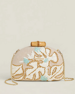 Beaded clutch bag with floral design on a beige background
