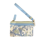 A small wristlet pouch with a light blue leather wrist strap and a floral tapestry patterned body in beige, blue, and green, featuring gold-tone hardware.
