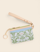 Load image into Gallery viewer, Floral-patterned pouch with a strap on a beige background
