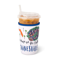 Load image into Gallery viewer, Swig Saturdays In Gainesville Iced Cup Coolie holding an iced coffee cup
