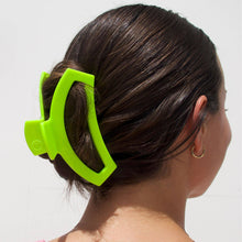 Load image into Gallery viewer, person with large hair clip in her hair
