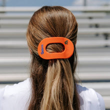 Load image into Gallery viewer, person wearing orange hair clip with gator logo and mascot 

