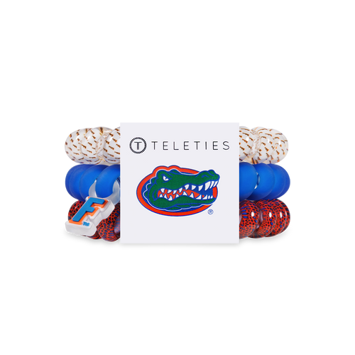 three large gator themed hair ties
