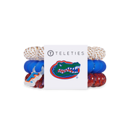 three large gator themed hair ties