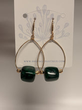 Load image into Gallery viewer, Gold hoop earrings with green beads on a branded card
