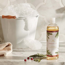 Load image into Gallery viewer, Thymes Frasier Fir All-Purpose Cleaning Concentrate sitting next to a bucket of soap suds 
