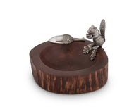 wooden bowl with silver color squirrel  standing on the rim and acorn shaped scoop sitting next to it