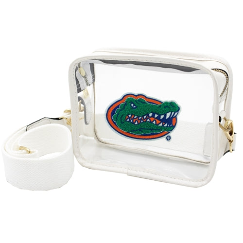Clear crossbody bag with white and gold accents and a UF gator logo on the front center of the bag