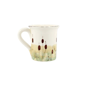 The back of a mug painted with cattails 