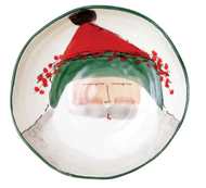 wide shallow bowl with a painted image of Santa in a hat with green trim