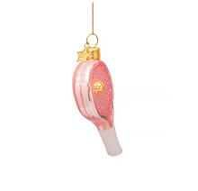 Load image into Gallery viewer, A novelty Christmas ornament shaped like a pink and white tennis racket with gold accents, hanging by a gold string against a plain white background.
