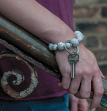 Load image into Gallery viewer, person wearing a Wrist Keychain in  Linen
