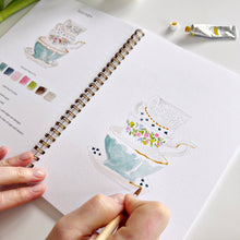 Load image into Gallery viewer, person painting a stack of tea cups
