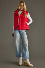 Load image into Gallery viewer, woman in a puffy Classic Red Vest paired with a white shirt and jeans with one hand in the pocket
