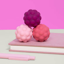 Load image into Gallery viewer, Odds Silicone Fidget Magnets on a notebook
