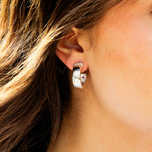 Load image into Gallery viewer, close up of a person wearing a Capucine de Wulf Jewelry Cleopatra Classic Hoop Earrings in silver

