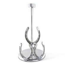 Load image into Gallery viewer, Paper Towel Holder decorated with three horseshoes in a silver color metal and a tall center rod to hold a roll of paper towels

